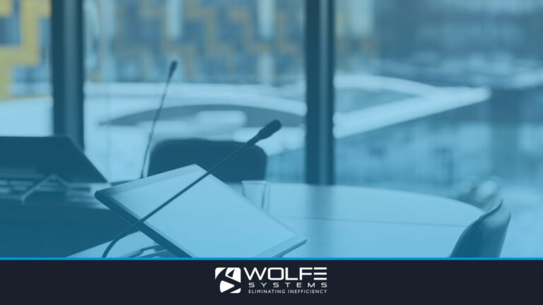 High-tech conference room with digital tablets and microphones for effective communication.