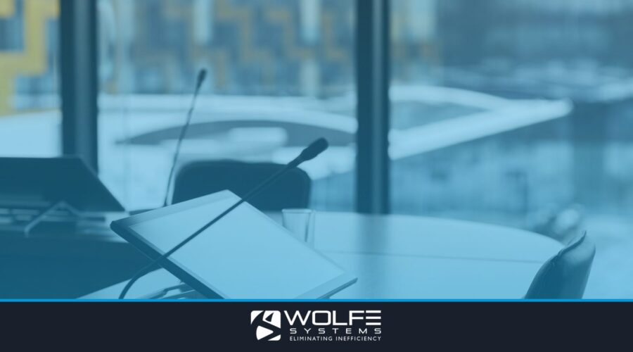 High-tech conference room with digital tablets and microphones for effective communication.