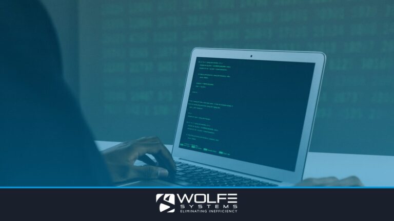 A focused adult working on a laptop demonstrates modern cybersecurity and coding skills indoors.
