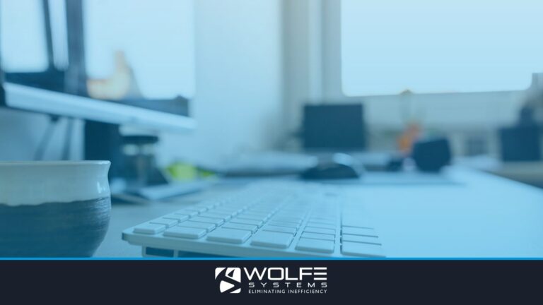 Modern office desk setup featuring a computer keyboard and monitor, ideal for workspaces.
