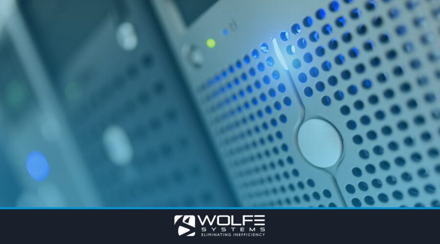 Focused detail of a modern server rack with blue LED indicators in a data center.